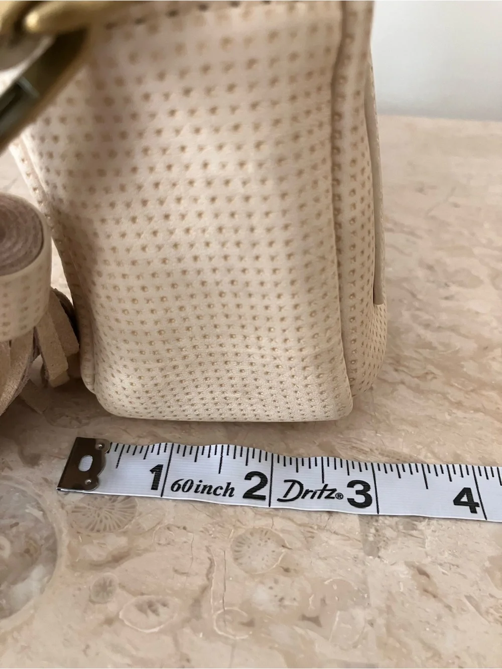 Anthropologie Cream Perforated Crossbody Camera Bag with Tassel